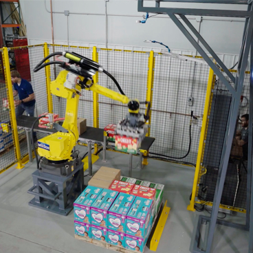Robotic arm picking up packaged goods