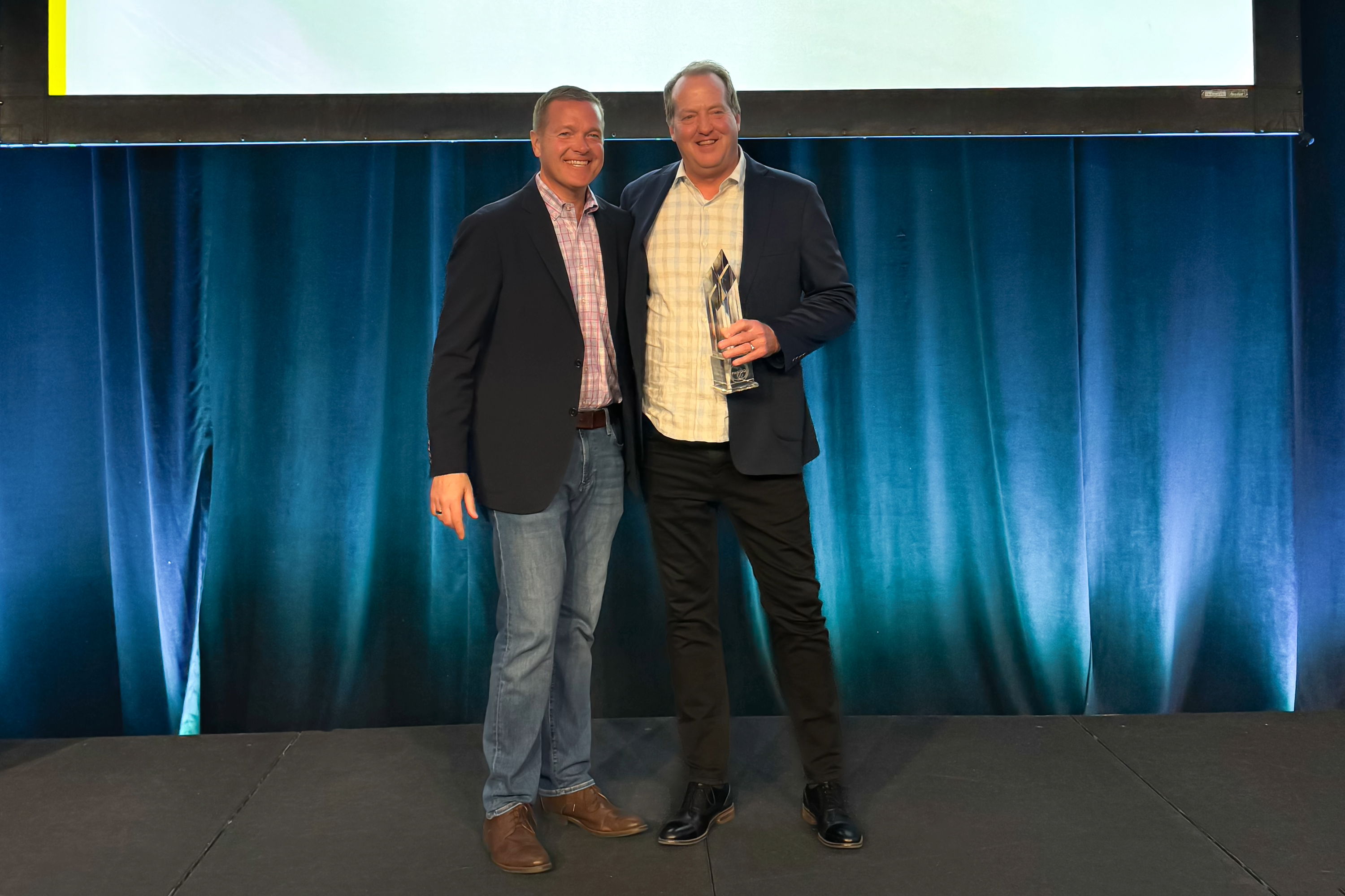 CEO Scot Lindemann accepting FANUC Exemplary Sales Award