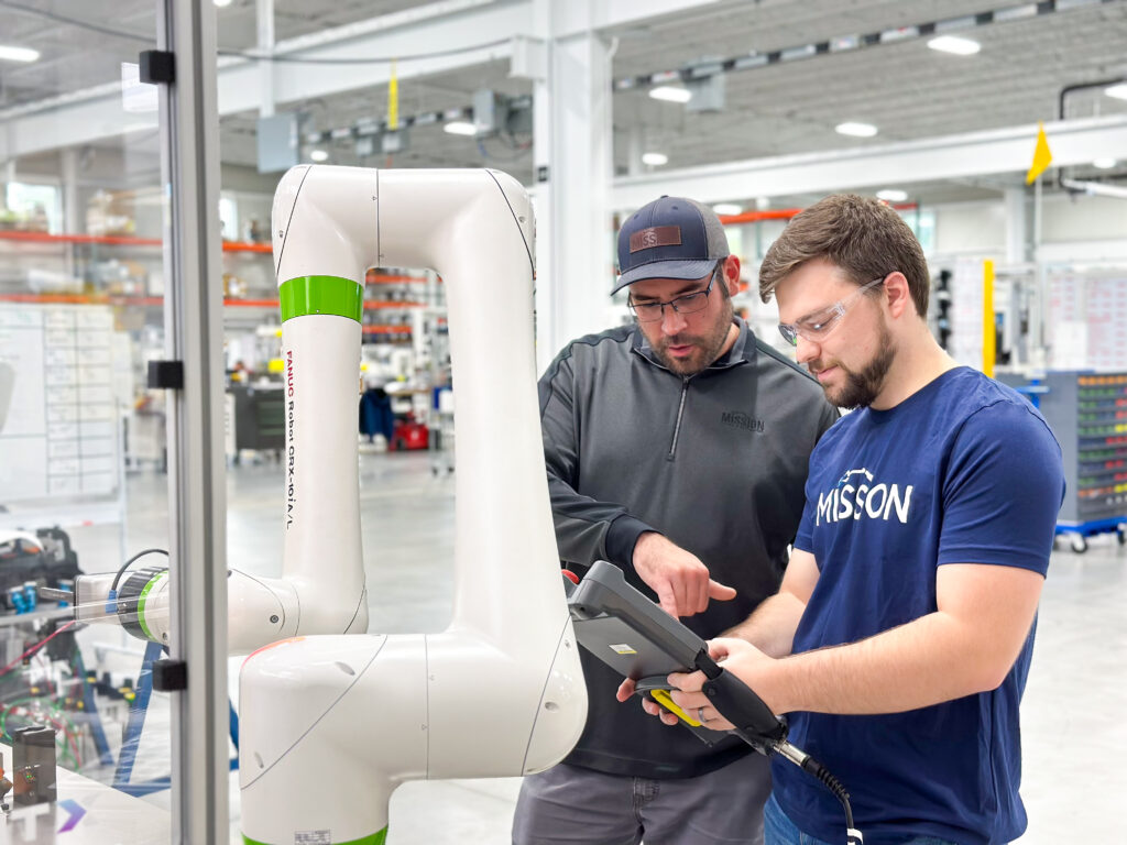 Steve Solack and Garrett Schafsnitz programming robot